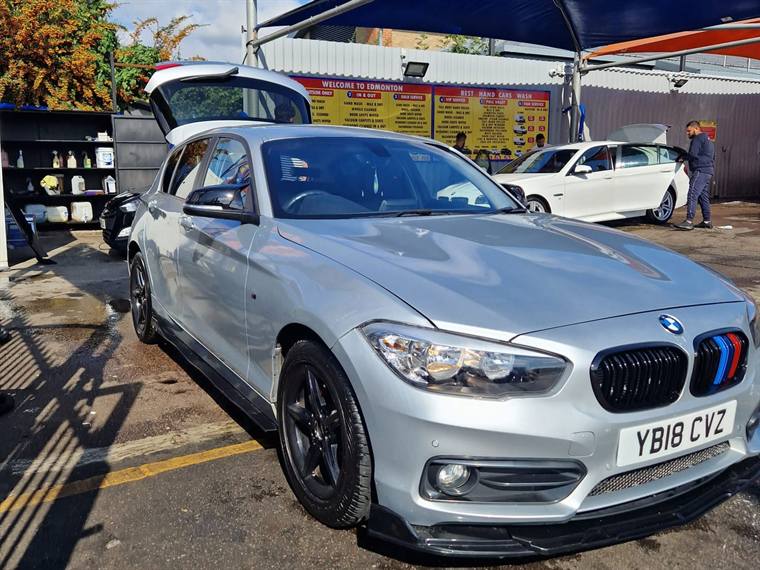 Silver BMW 1 Series finished and parked outside the N17 Bodyworks workshop