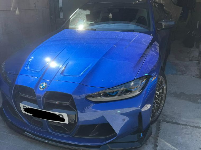Blue BMW M4 with finished paintwork ready for collection